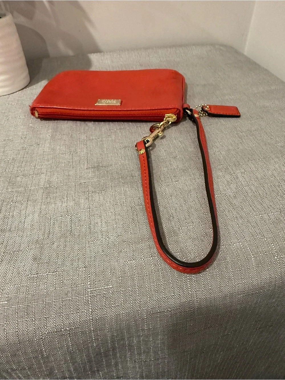 Coach Coral Leather Wristlet with Gold Plaque